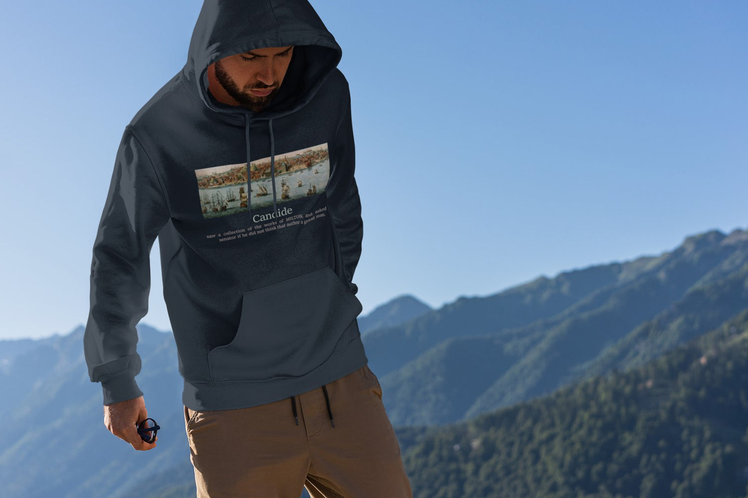 Man wearing quite literary hoodie on mountain top